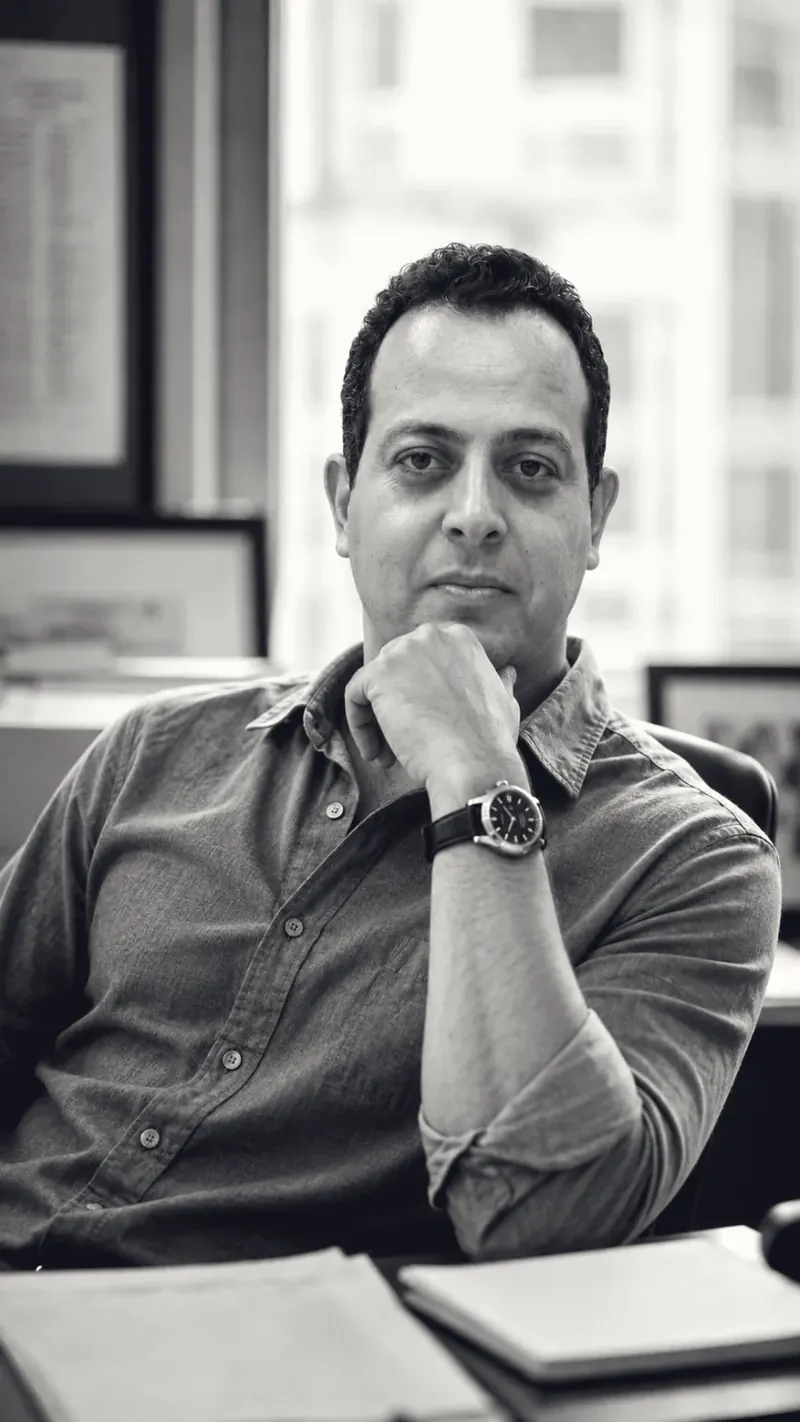 Mohamed B. Kumiha working at a desk with notes