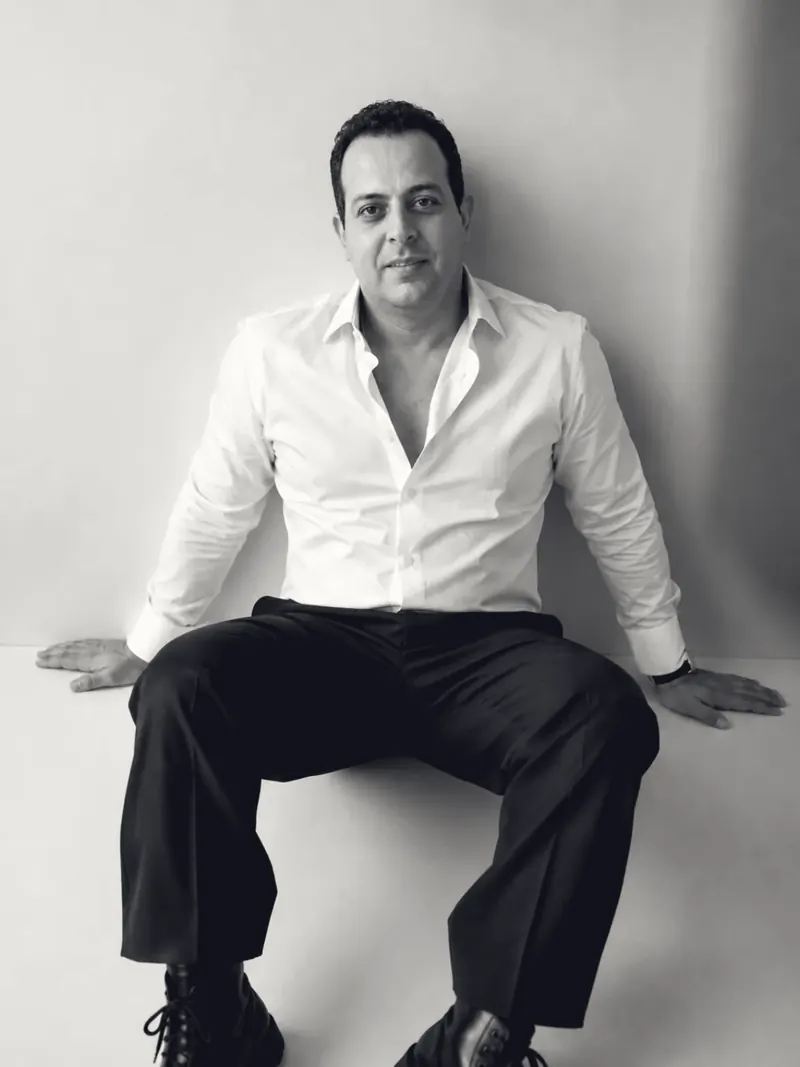 Mohamed B. Kumiha seated in a studio portrait